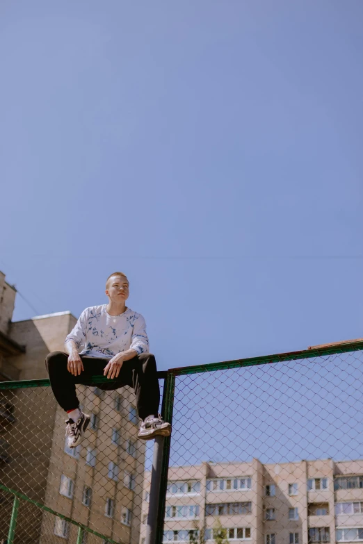 a man flying through the air while riding a skateboard, an album cover, trending on unsplash, happening, girl sitting on a rooftop, standing astride a gate, clear blue sky, portrait shot 8 k