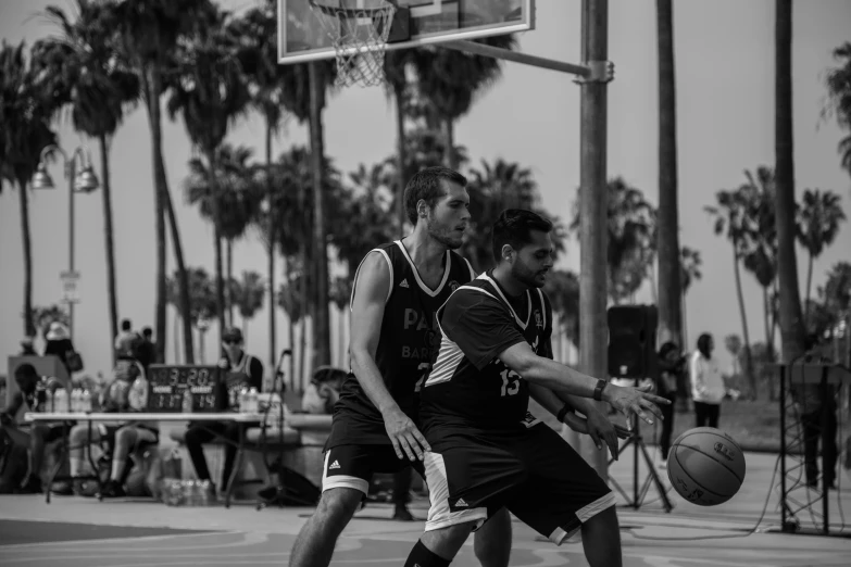 a couple of men playing a game of basketball, a black and white photo, 15081959 21121991 01012000 4k, los angeles ca, black jersey, 8k photo