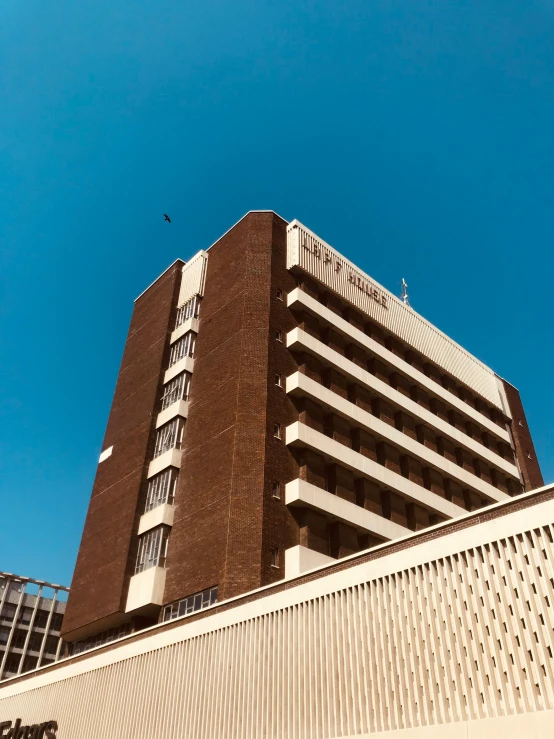 a building with a sky in the background