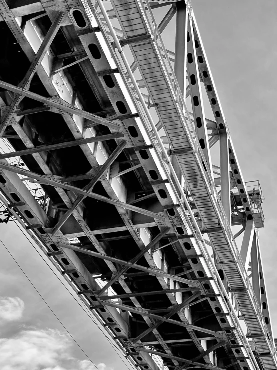 a black and white photo of a bridge, a portrait, inspired by Alexander Rodchenko, high detail - n 4, hell gate, white mechanical details, low angle!!!!