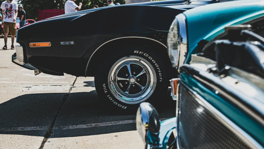 an old car is parked on the side of the road