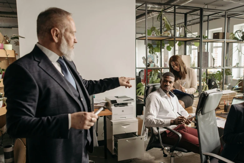 a man giving a presentation to a group of people, pexels contest winner, renaissance, sitting in office, avatar image, cinematic image, high quality picture