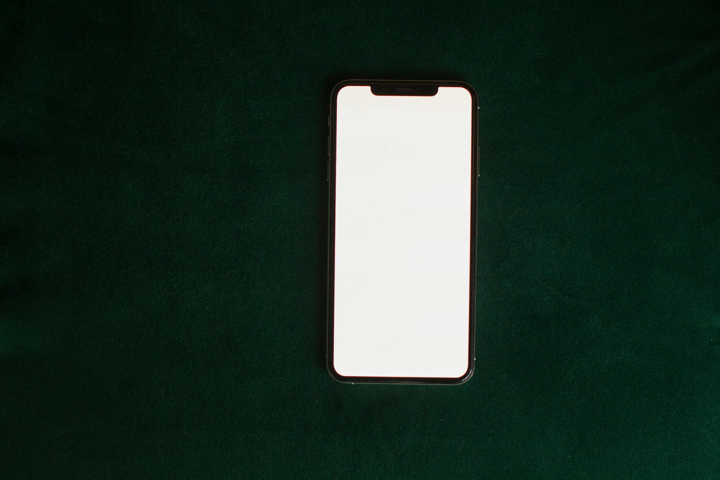 a close up of a cell phone on a green surface, trending on pexels, blank, square, screen light, portrait n - 9