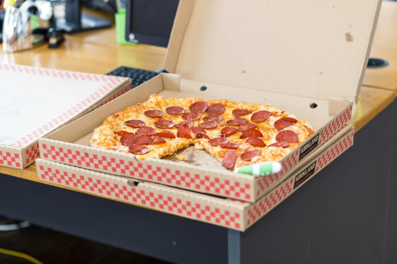 a box of pepperoni pizza sitting on top of a desk, by Matthew Smith, 3 / 4 photographic close, multicoloured