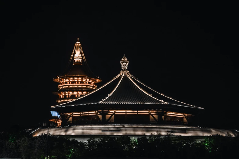 the lighted up building has two towers