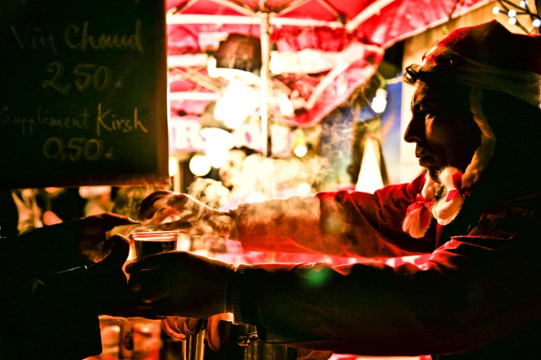 there is a man that is sitting at the counter