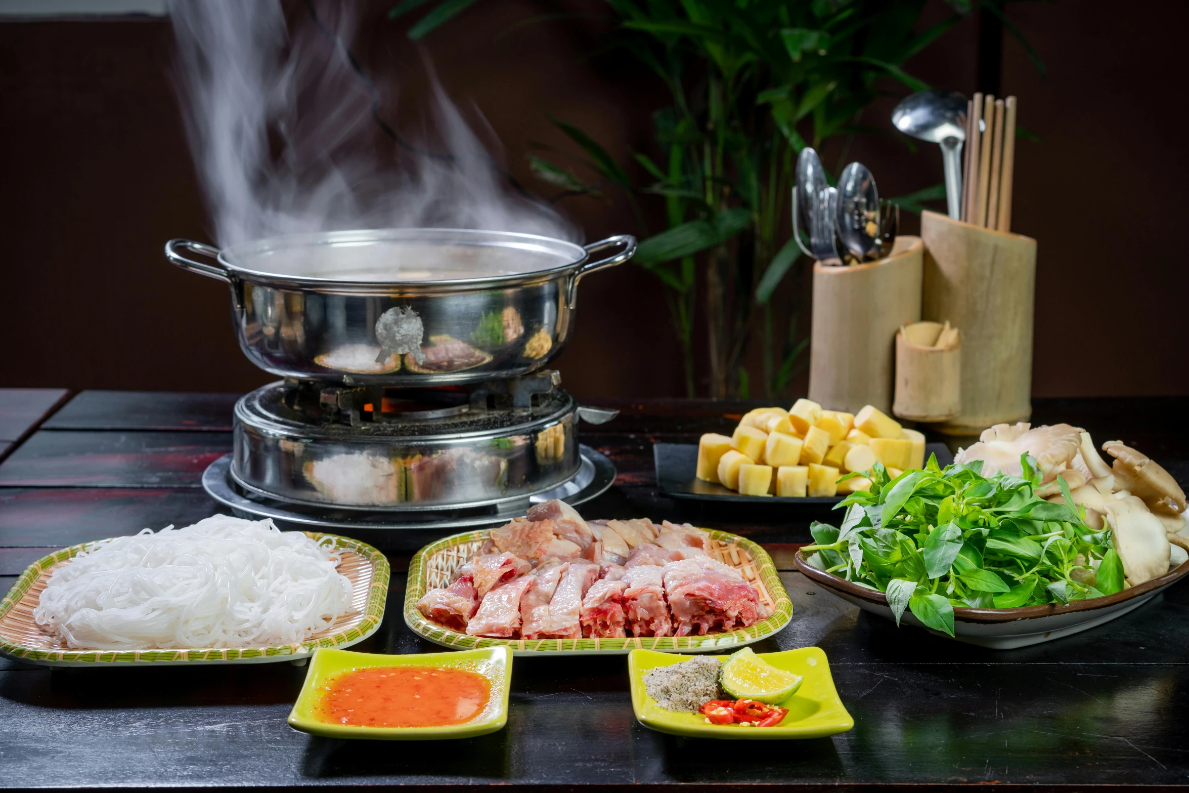 a table topped with lots of different types of food, steamboat willy, profile image, phuoc quan, lots of steam and sparks