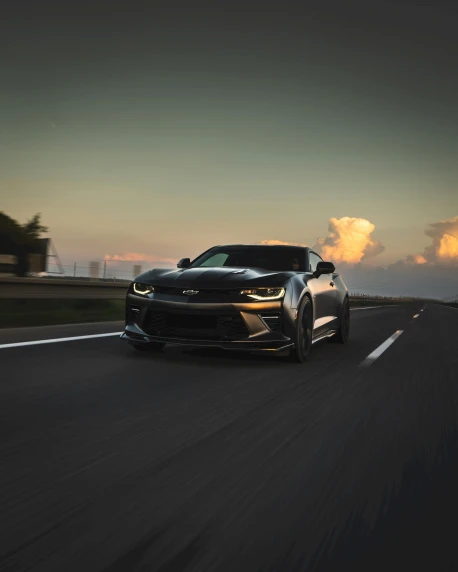 the black and silver camaro sse on a highway