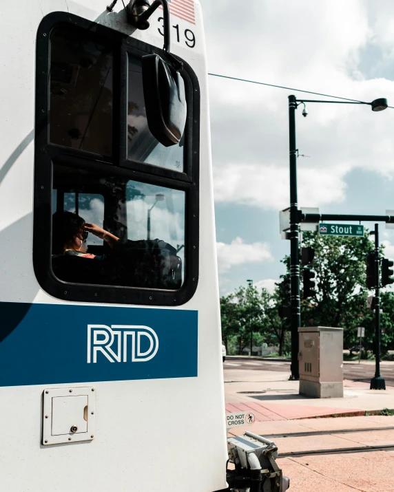 a person in the drivers seat of a bus