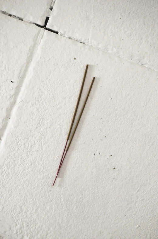 a pair of scissors sitting on top of a piece of paper, incense, 1960s color photograph, very long spires, marin kitagawa