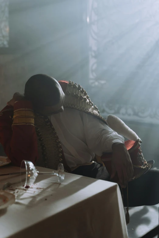 an african american man sitting on a chair