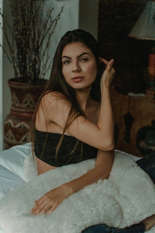 a beautiful young woman sitting on top of a bed, a portrait, inspired by Elsa Bleda, reddit, premium, profile image, beautiful iranian woman, attractive photo