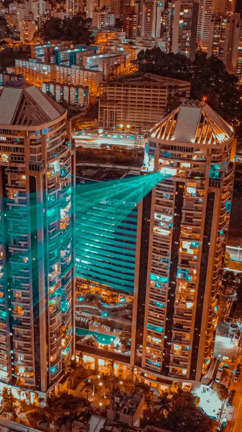 an aerial view of a city at night, a screenshot, by Beeple, pexels contest winner, transparent building, teal electricity, jakarta, laser beam ; outdoor