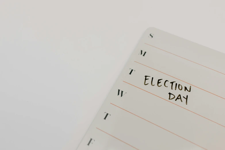 a piece of paper with the word election day written on it, trending on unsplash, whiteboards, female calendar, b, electrical