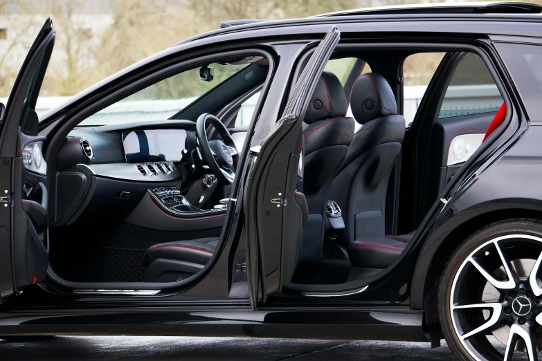 a close up of a car with its door open, black steel with red trim, ready for a meeting, mercedes, medium