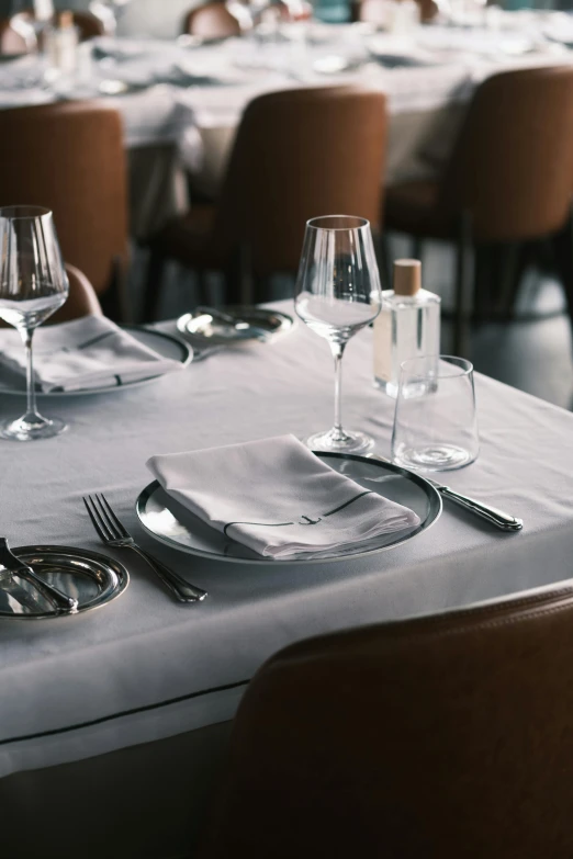 a table that has a bunch of place settings on it, by Jesper Knudsen, unsplash, renaissance, michelin starred restaurant, cloth and metal, 64x64, white cloth