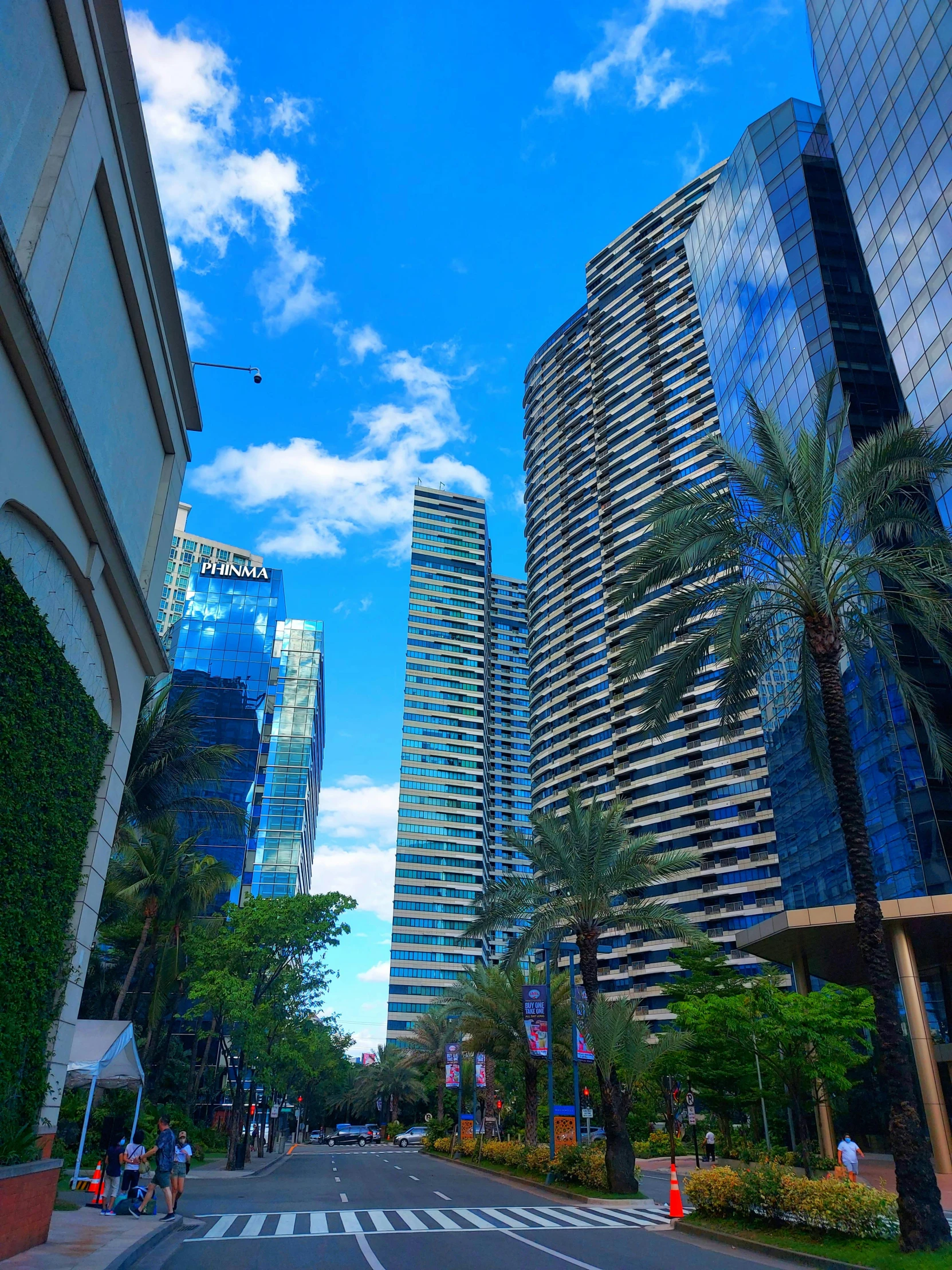 a very tall building next to many other buildings