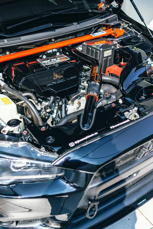 a close up of the engine of a car, samurai vinyl wrap, orange details, dynamic angled shot, rb 6 s