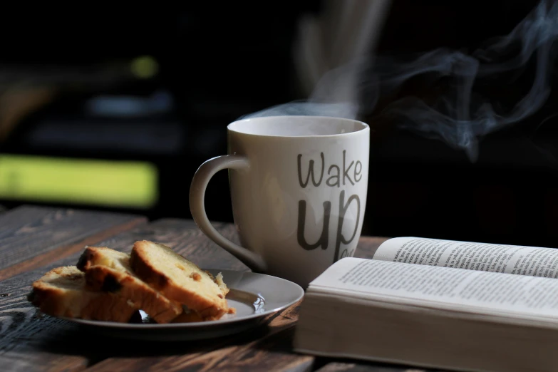 a book sitting on top of a wooden table next to a cup of coffee, pexels contest winner, happening, wake up, breakfast, laura watson, religious