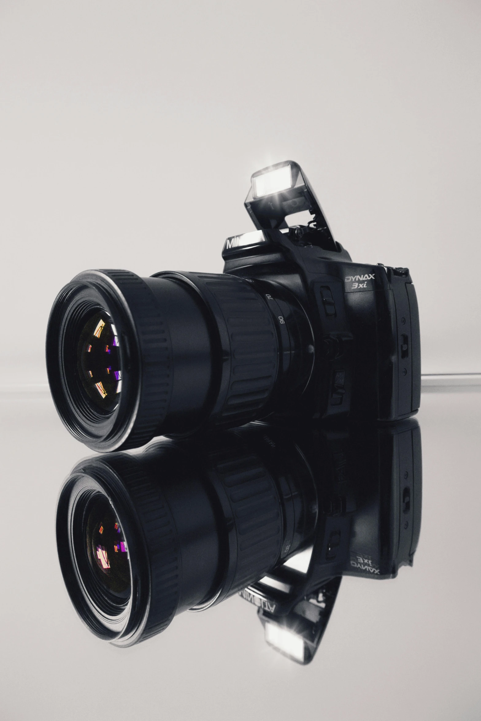 a couple of cameras sitting on top of a table, unsplash, photorealism, reflective lens, cinematic shot ar 9:16 -n 6 -g, towering over the camera, close up. macro. hyper realistic