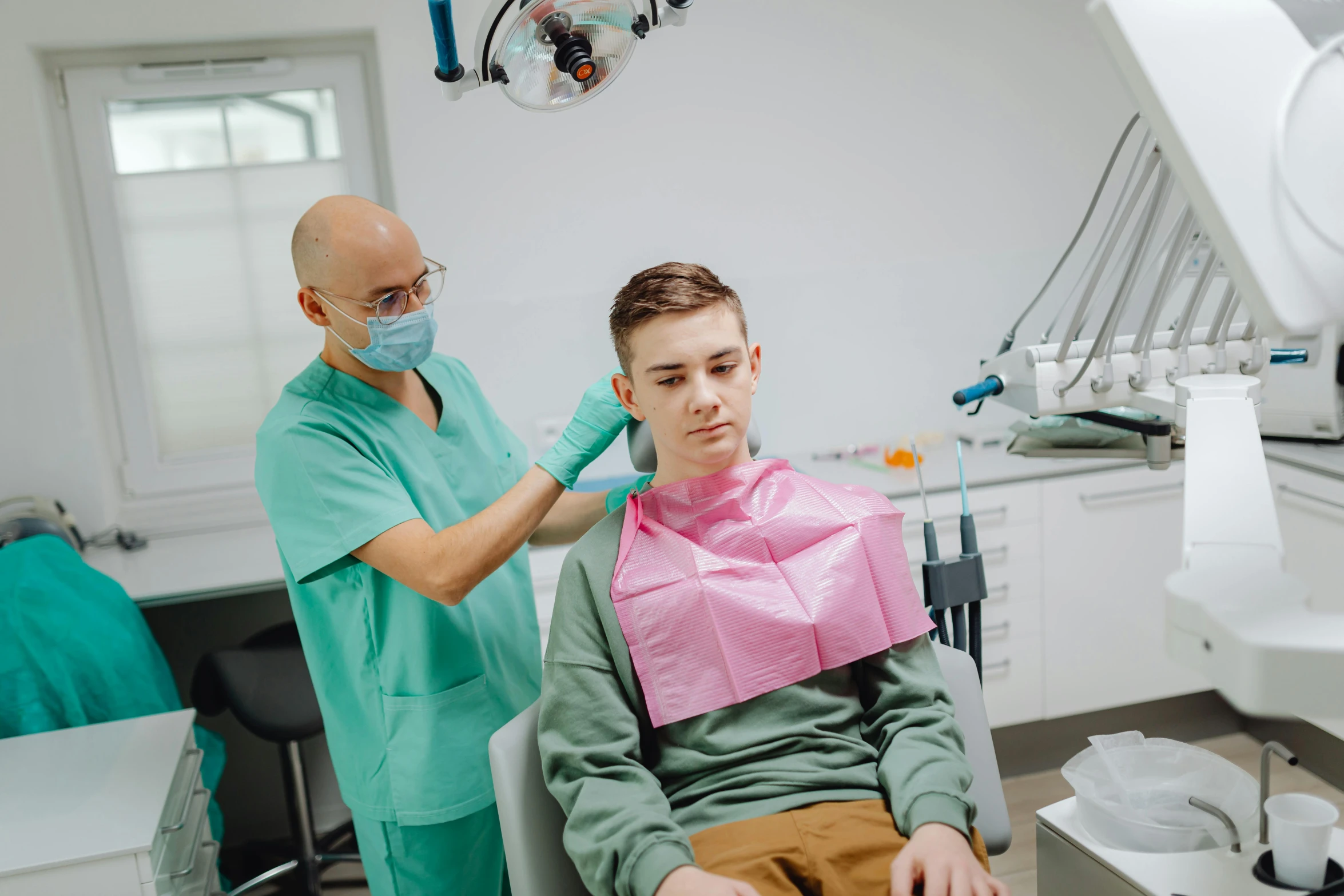 a man sitting in a chair in a dentist's office, a colorized photo, pexels contest winner, hurufiyya, teenage boy, youtube thumbnail, high gradient, damien tran