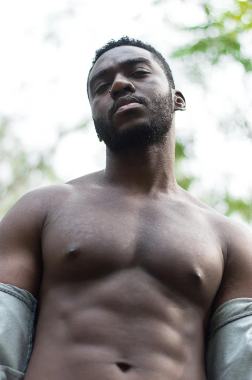 a man is posing with his shirt down