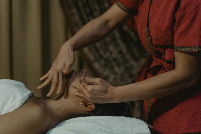 a woman getting a facial massage at a spa, a sketch, unsplash, hurufiyya, south east asian with long, thumbnail, cinematic still, indian master