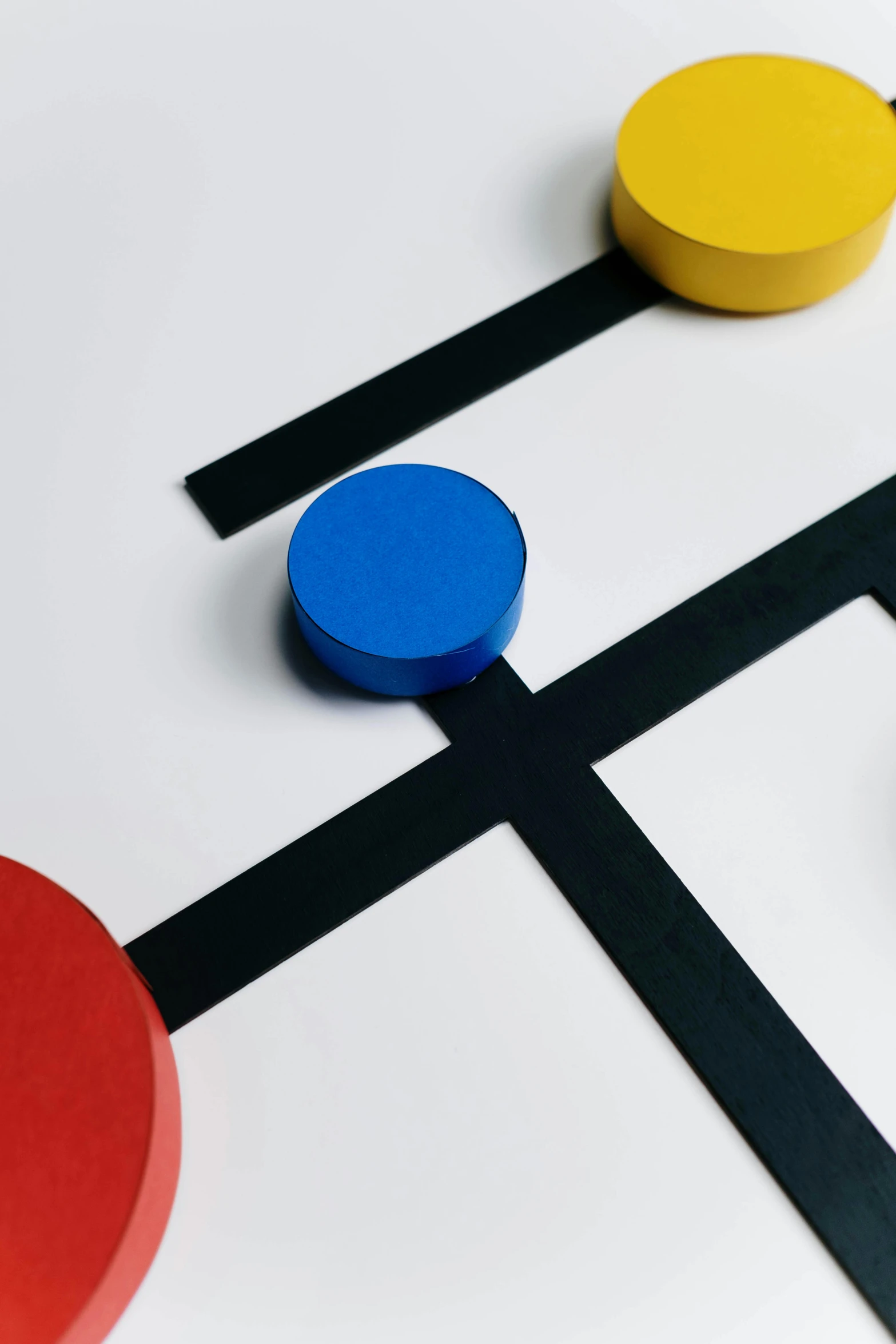 a close up of a board game on a table, inspired by Bauhaus, paper cut out, multi - coloured, detail shot, 120mm