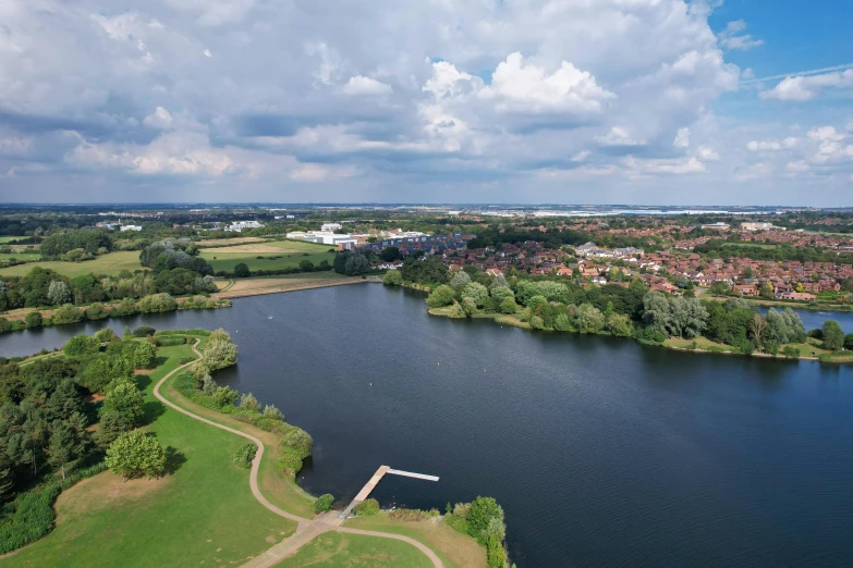 a large body of water surrounded by trees, elstree, rivers and lakes, carrington, a high angle shot