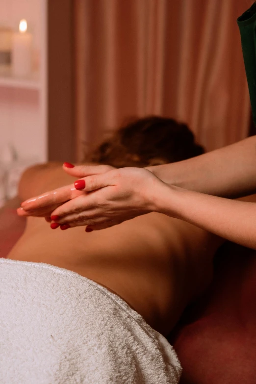 a woman getting a back massage at a spa, by Julia Pishtar, trending on pexels, renaissance, red robe, 15081959 21121991 01012000 4k, big hands, mid view