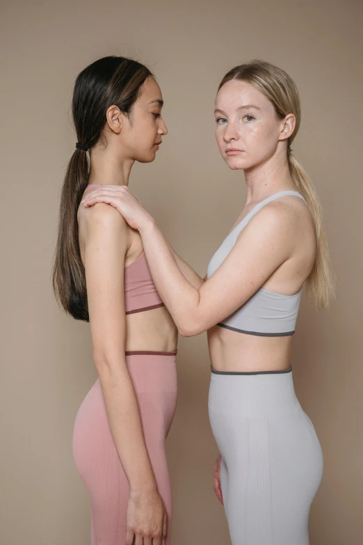 two young women standing next to each other