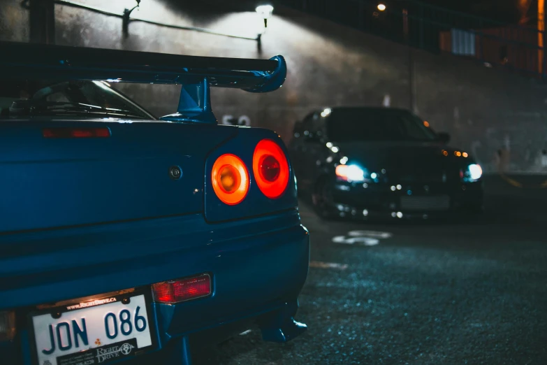 two cars in a parking lot next to each other