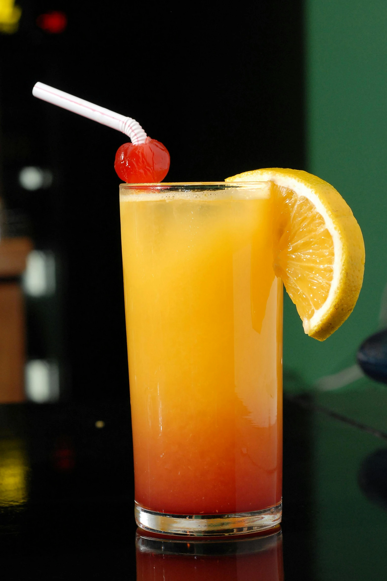 a close up of a drink in a glass on a table