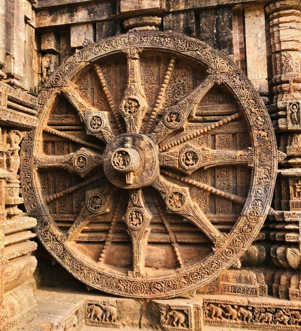 a stone wheel sitting on the side of a building, vishnu, 8 k -, thomas veyrat intricate, ancient temple