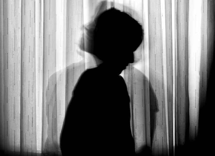 a silhouette of a person standing in front of a curtain, a black and white photo, childhood friend, stockphoto, face photo, set photo