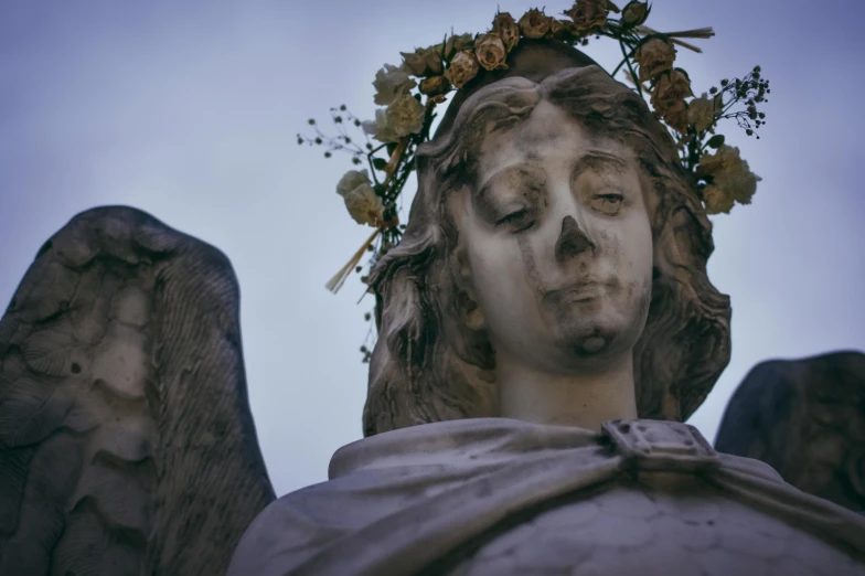 a statue of an angel with a crown of flowers on its head, by Daniel Lieske, pexels contest winner, haunting face, buenos aires, avatar image, giant grave structures