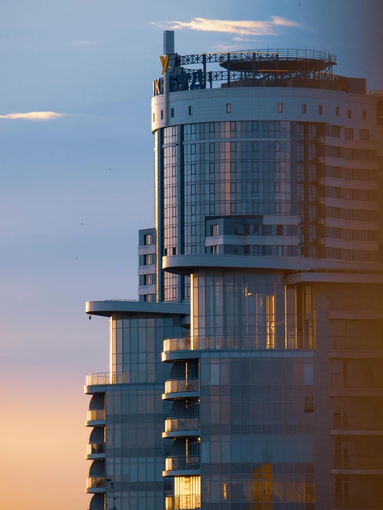 a tall building in the background with a blue sky