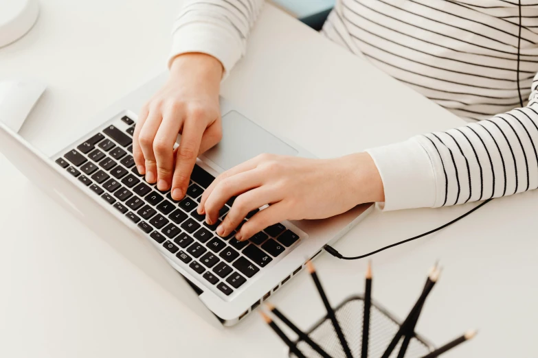 a close up of a person typing on a laptop, by Carey Morris, trending on pexels, avatar image, white backround, hard lines, schools