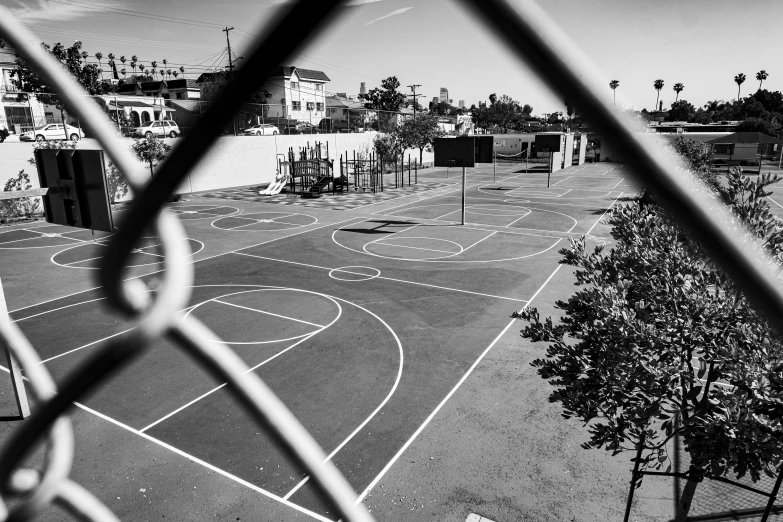 a black and white photo of a basketball court, by Adam Rex, los angeles ca, in a square, schools, casey cooke