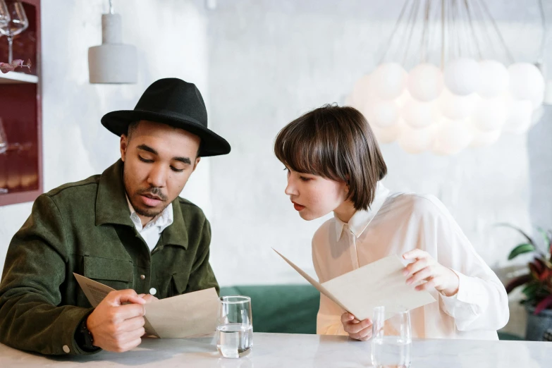 a man and a woman sitting at a table, pexels contest winner, private press, diverse, trying to read, wearing white chef hat, charli bowater and artgeem