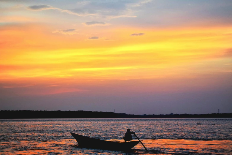 a person in a boat on a body of water, a picture, orange skies, afar, promo image, sri lanka