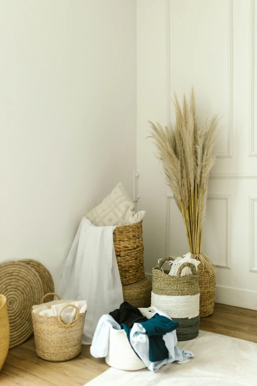 a white rug sitting on top of a wooden floor, various items, wicker art, white broom closet, product photo