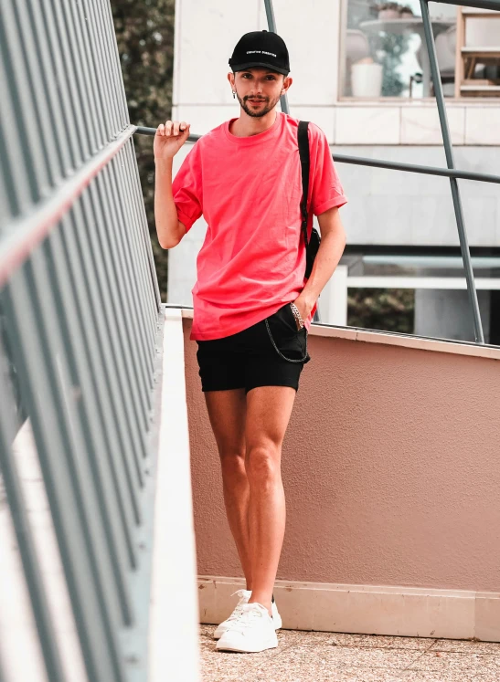 the man is standing on the outside balcony