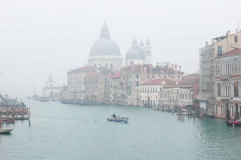 a couple of boats that are in the water, inspired by Quirizio di Giovanni da Murano, pexels contest winner, light grey mist, city view, winter photograph, single