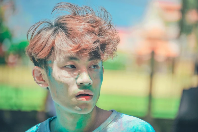 a close up of a person with a frizbee in his hair, inspired by Kim Myeong-guk, pexels contest winner, color field, dirty face, seapunk, teenage boy, celebrating