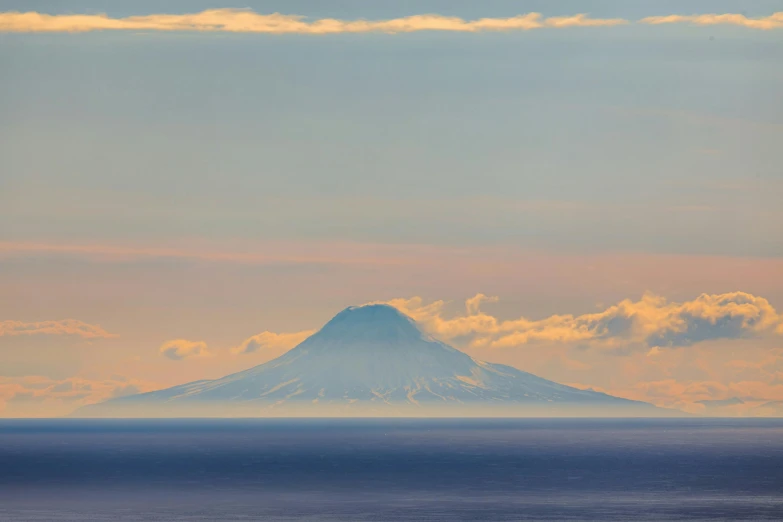 there is a mountain with a white substance on top