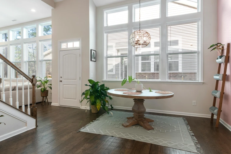 large entryway with entry way leading up to a hall