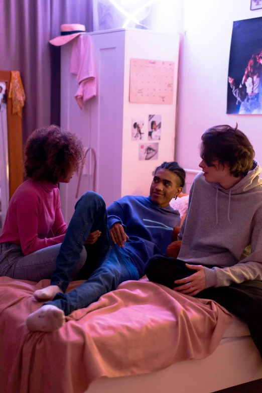 a group of people sitting on top of a bed, antipodeans, film still of barack obama, bisexual lighting, cosy vibes, vibrant scene