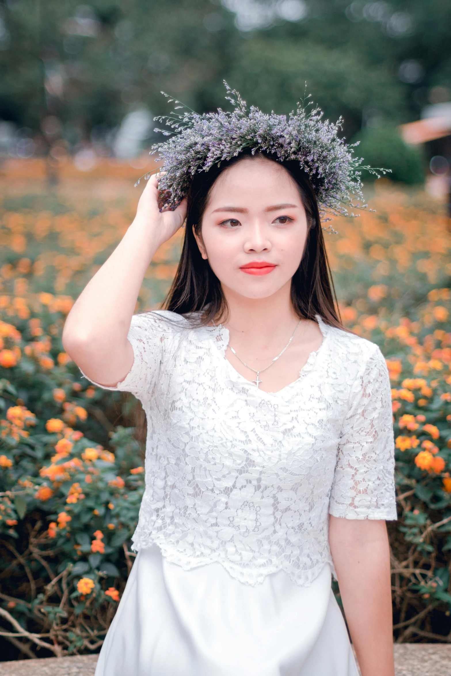 a woman standing in front of a field of flowers, inspired by Ruth Jên, pexels contest winner, young cute wan asian face, ornamental halo, white and orange, wearing casual clothing