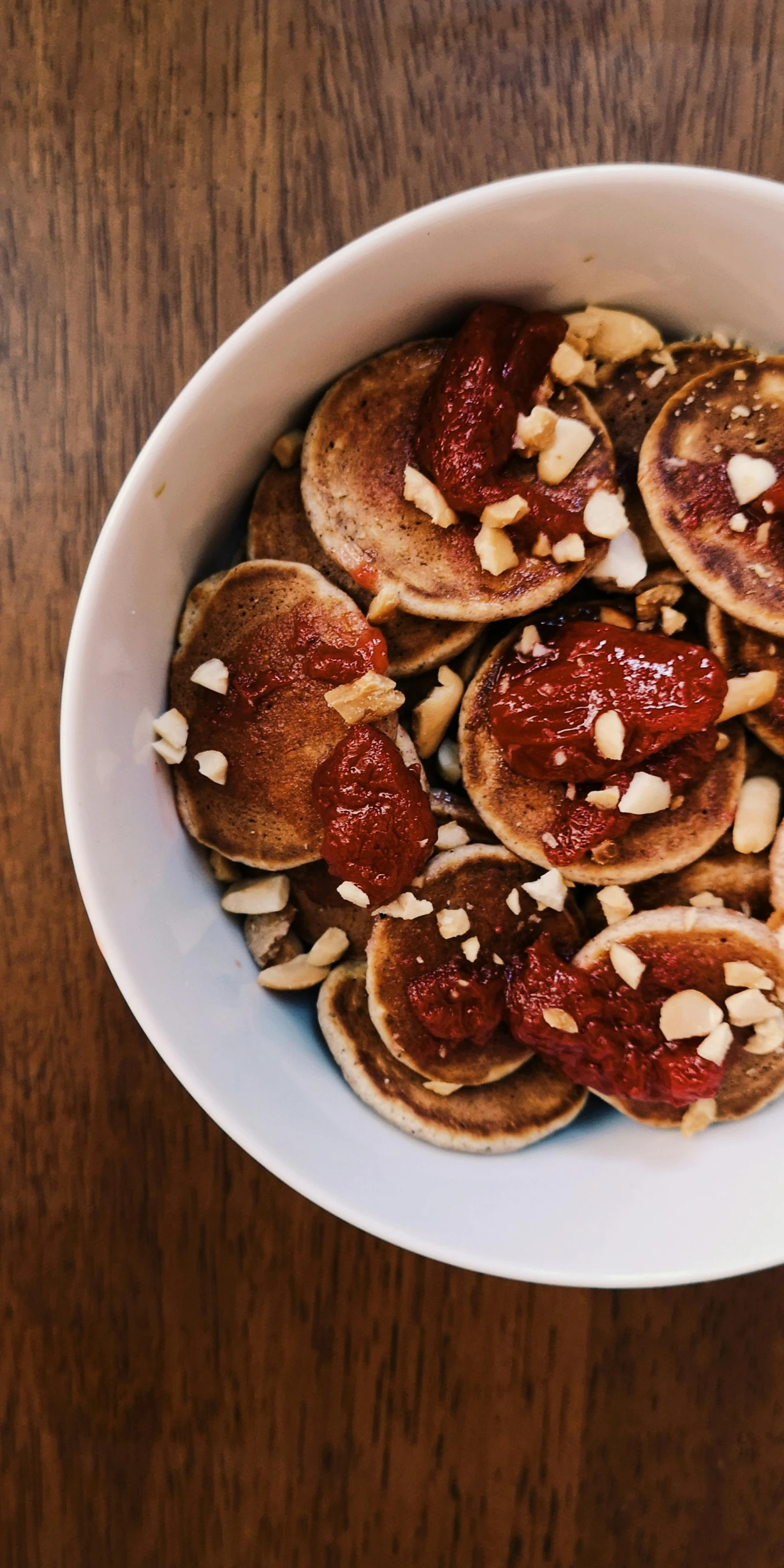 a bowl filled with pancakes and topped with a peanut er